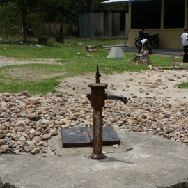 Defunct pump in schoolyard. It no longer produces water